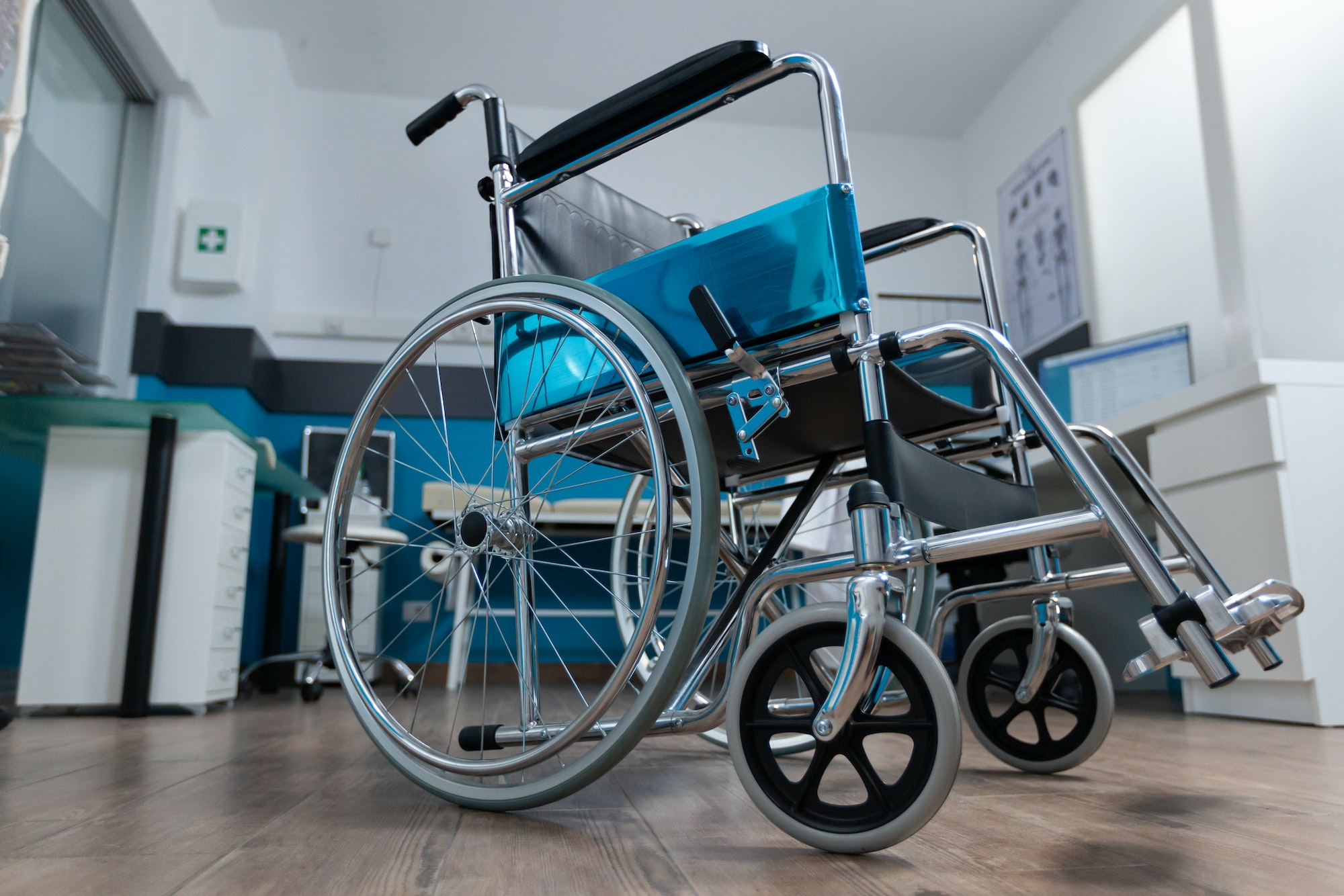 Empty office space with nobody in it having medical wheelchair