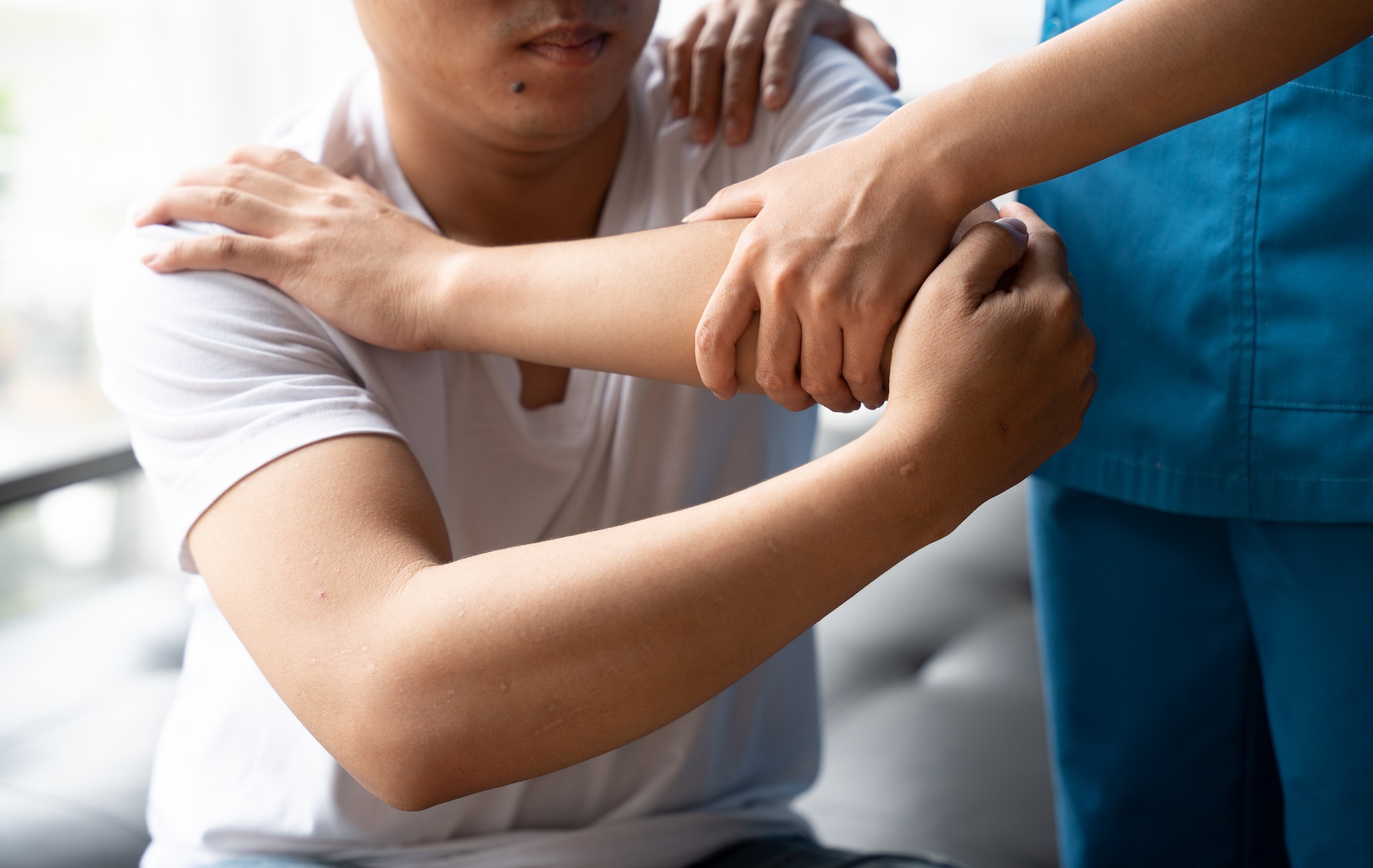 Physical therapy concept, Asian man is admitted to physiotherapy in a hospital.